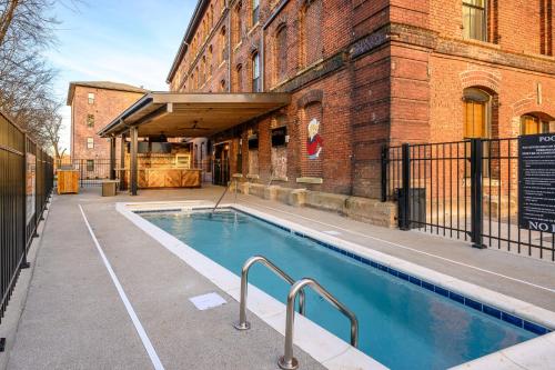 a swimming pool in front of a building at The 1865 #113 in Nashville