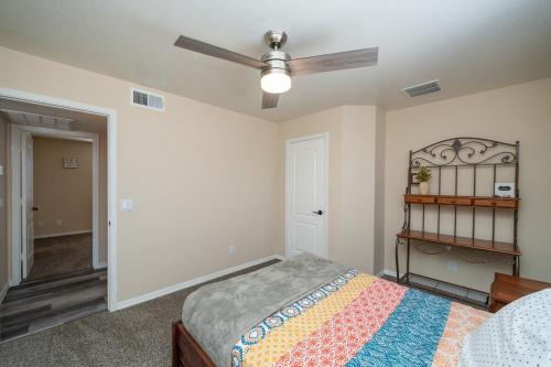 a bedroom with a bed and a ceiling fan at Havasu Oasis Games for Kids BBQ Boat Parking in Lake Havasu City