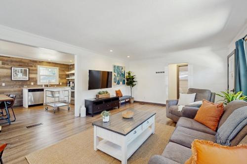 a living room with a couch and a table at Manzanita Holiday 1 in South Lake Tahoe