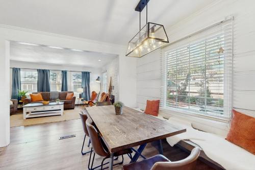 a living room with a wooden table and chairs at Manzanita Holiday 1 in South Lake Tahoe