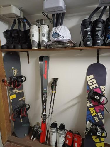 a shelf with skis and snowboards on it at Haus Piller in Bad Hofgastein