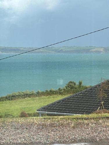a view of the ocean from a house at Cois Cuan in Ballynagaul