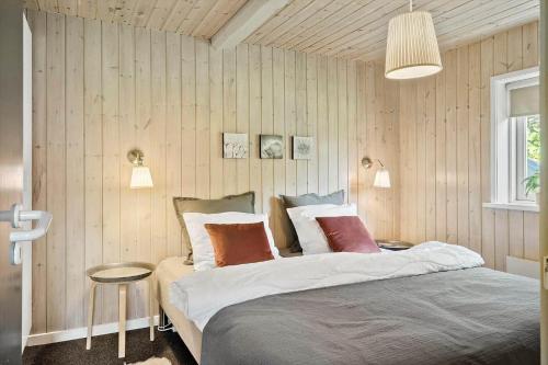 a bedroom with a large bed and a table at LF11109-Struer-Barsidalvej-9 in Struer