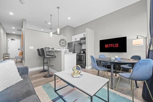 a living room with a couch and a table at 1BR • City Views • Queen + SofaBed • WiFi & 2 TVs in Cleveland