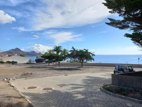 a parking lot with a view of the ocean at Charming Beach Villa Porto Santo in Porto Santo