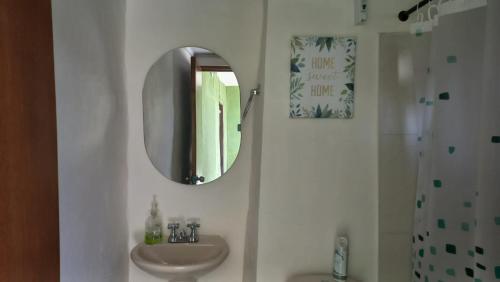 a bathroom with a sink and a mirror at Casa turística la Nativa 