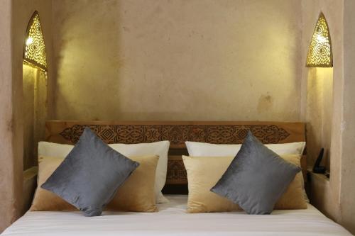 Maison D'hôtes IMINIGRAN & Spaにあるベッド
