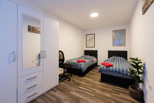 Postel nebo postele na pokoji v ubytování Apartment auf dem Petersberg mit Parkplatz "Access"