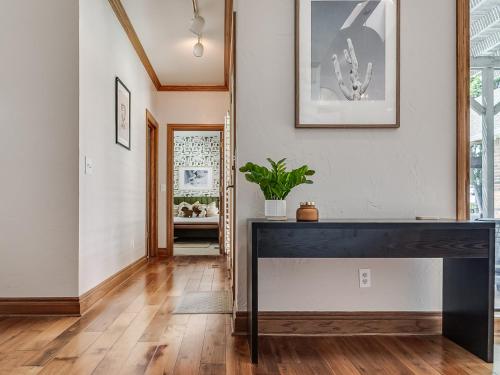 a large black table in a room with a hallway at The Big Friendly - A family retreat, heated pool, hot tub, game room minutes away from DT OKC in Oklahoma City