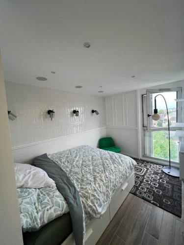 Una cama o camas en una habitación de Le duplex