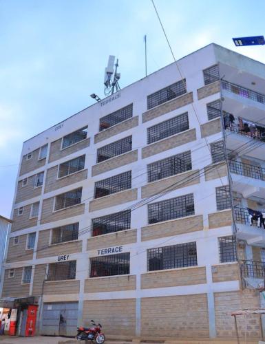 a building with a motorcycle parked in front of it at The Blue Haven in Nairobi