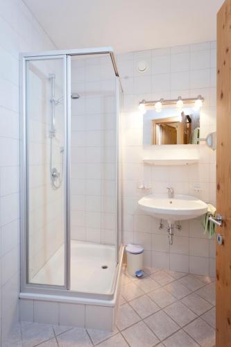 a bathroom with a shower and a sink at Ferienhaus Auer in Nauders