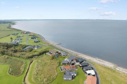 an aerial view of a house next to the water at LF12006-Handbjerg-Runddelen-6 