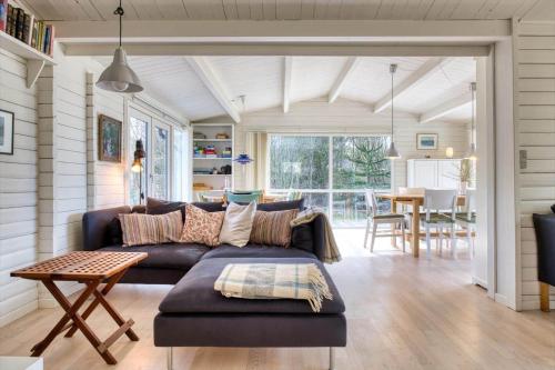 a living room with a couch and a table at LF14132-Spottrup-Porfyrvej-2 in Spottrup