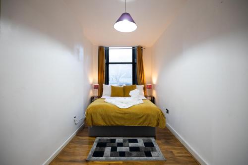 Katil atau katil-katil dalam bilik di Sauchihall Apartment