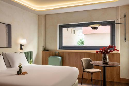 a hotel room with a bed and a window at Salitre Hotel, Sonder by Marriott Bonvoy in Málaga