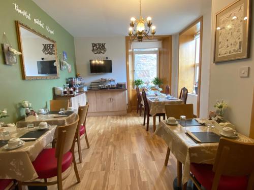 a restaurant with tables and chairs in a room at No 29 Bed and Breakfast in Inverness