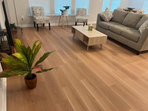 a living room with a couch and a coffee table at NEW HOUSE! 4BR Entire house Near Airport in Savannah
