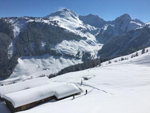 a group of people standing on a snow covered mountain at Appartement Haus Seerose in Reith im Alpbachtal
