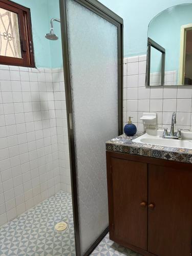 a bathroom with a shower and a sink at Casa Yuya in Valladolid