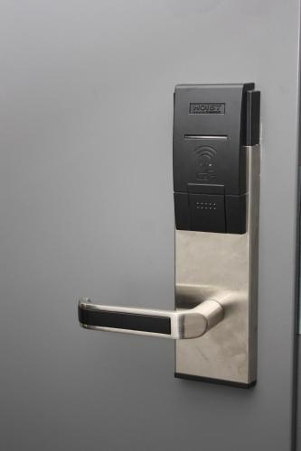 a paper towel dispenser attached to a wall at First Hotel Jörgen Kock in Malmö
