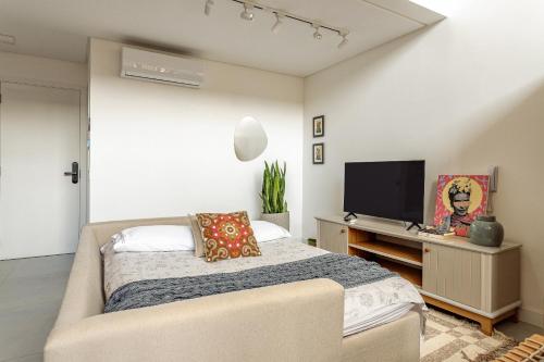 Ένα ή περισσότερα κρεβάτια σε δωμάτιο στο Duplex Moderno Novo Campeche, WiFi 1GB, 500m da praia