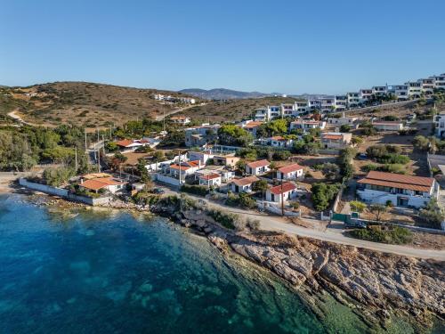 an aerial view of a village next to the water at Art Sounion, Seafront Elegance in Sounio