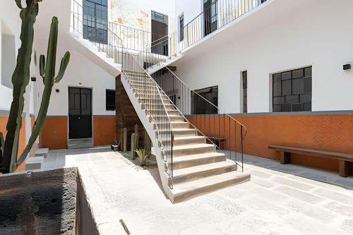 a stairwell in a building with a stair case at Casa 212 con WIFI alta velocidad y estacionamiento in Puebla