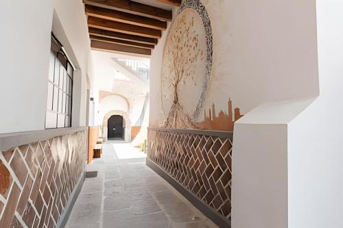 a hallway of a building with a mural on the wall at Casa 212 con WIFI alta velocidad y estacionamiento in Puebla