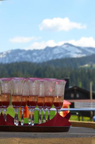 a group of wine glasses sitting on a table at Winklmoos Sonnenalm in Reit im Winkl