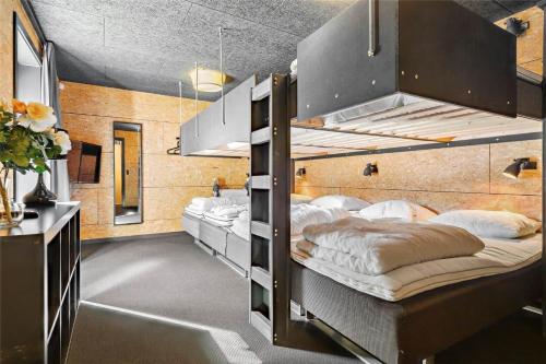 a room with two bunk beds in it at OH376-Hadsund-Sommerland-56-a in Hadsund