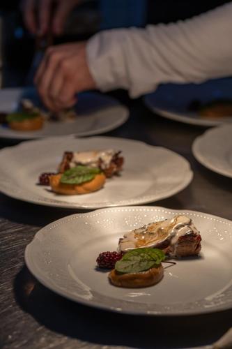 a group of plates of food on a table at Correntoso Lake & River Hotel in Villa La Angostura