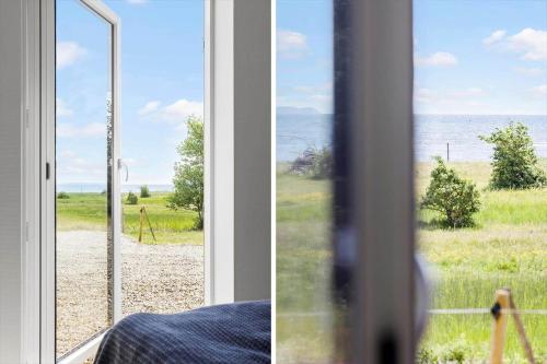 an open window with a view of the ocean at LF18127-Veslos-Livovej-29 in Vesløs