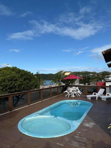 a swimming pool on the deck of a resort at Ingá Praia hotel in Natal
