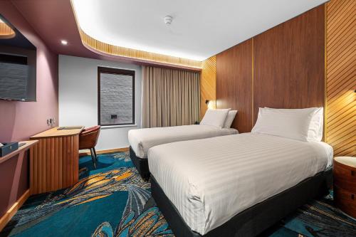 George Hotel Launcestonにあるベッド