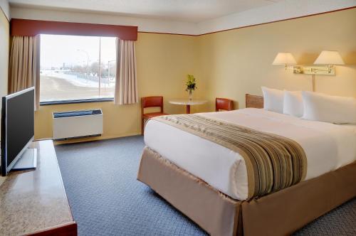 Ένα ή περισσότερα κρεβάτια σε δωμάτιο στο Kindersley Inn