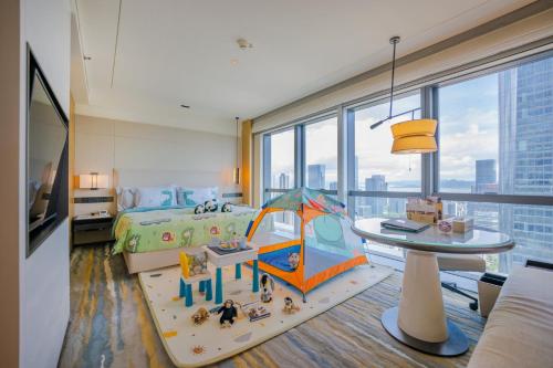 a bedroom with a bed with a tent in it at Crowne Plaza Shenzhen Nanshan by IHG in Shenzhen