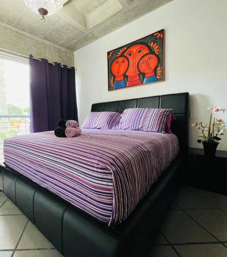 a bedroom with a bed with a teddy bear on it at Avila apartment in Caracas