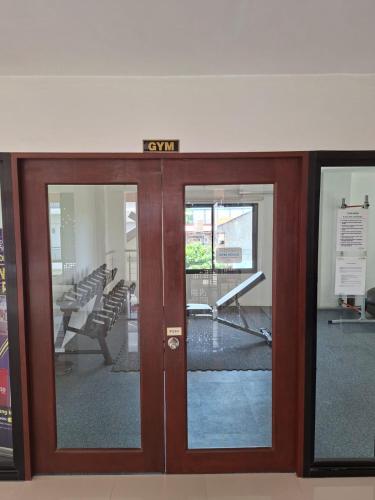 an exit sign on a door in a building at EuroAsian Royal Oceancrest Mactan in Sudtungan