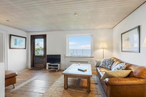 a living room with a couch and a coffee table at FY297-Faaborg-Ostergyden-37 in Nabbe