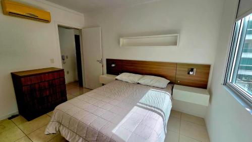 En eller flere senge i et værelse på Jardim Cristal