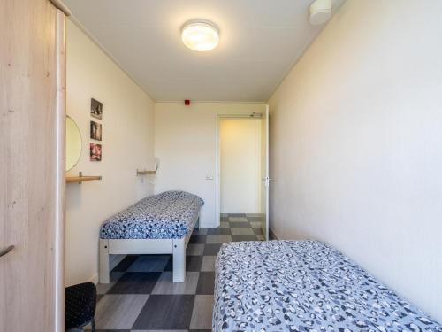 Ένα ή περισσότερα κρεβάτια σε δωμάτιο στο Groep in Friesland
