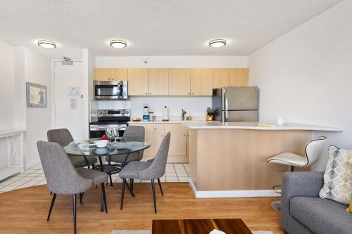 a kitchen and living room with a table and chairs at Fabulous Mountain View with Free Parking, Near Waikiki Beach in Honolulu