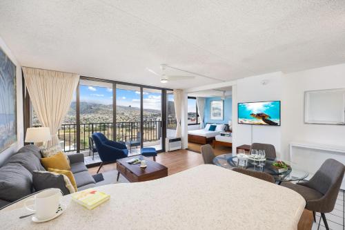 a living room with a couch and a table at Fabulous Mountain View with Free Parking, Near Waikiki Beach in Honolulu