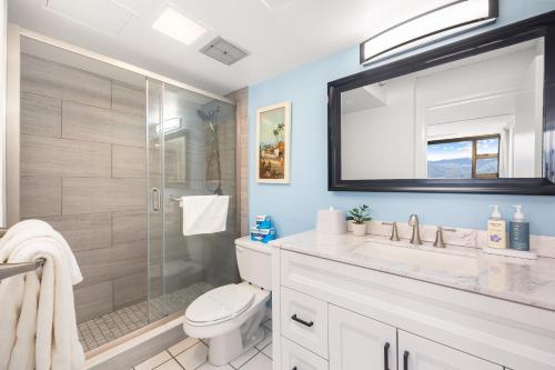 a bathroom with a shower and a toilet and a sink at Fabulous Mountain View with Free Parking, Near Waikiki Beach in Honolulu