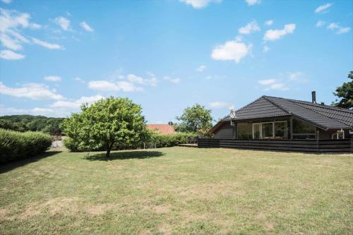 a house with a large yard in front of it at FY132-Middelfart-Stjernevej-109 in Middelfart