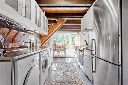 a kitchen with a washer and dryer at FY174-Asperup-Sommerlandsvej-23 in Asperup