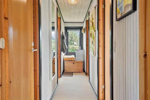 a hallway of a home with a hallway leading into a room at FY348-Svendborg-Storkenaebsvej-1 in Svendborg