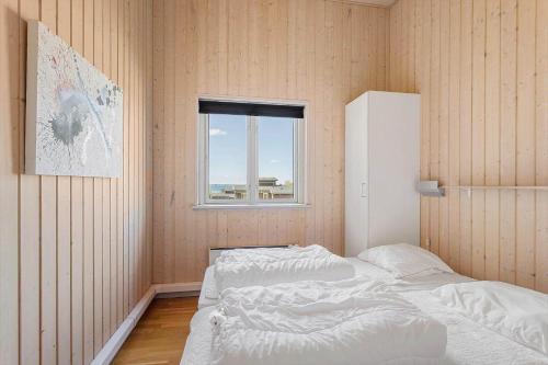 a bedroom with two beds and a window at FY300-Faaborg-Mosegarden-43 in Bogentved