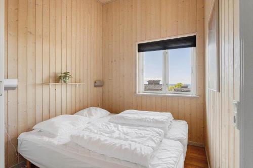 a bed in a room with a window at FY300-Faaborg-Mosegarden-43 in Bogentved